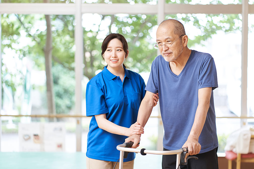Elderly people walking with walking assistance