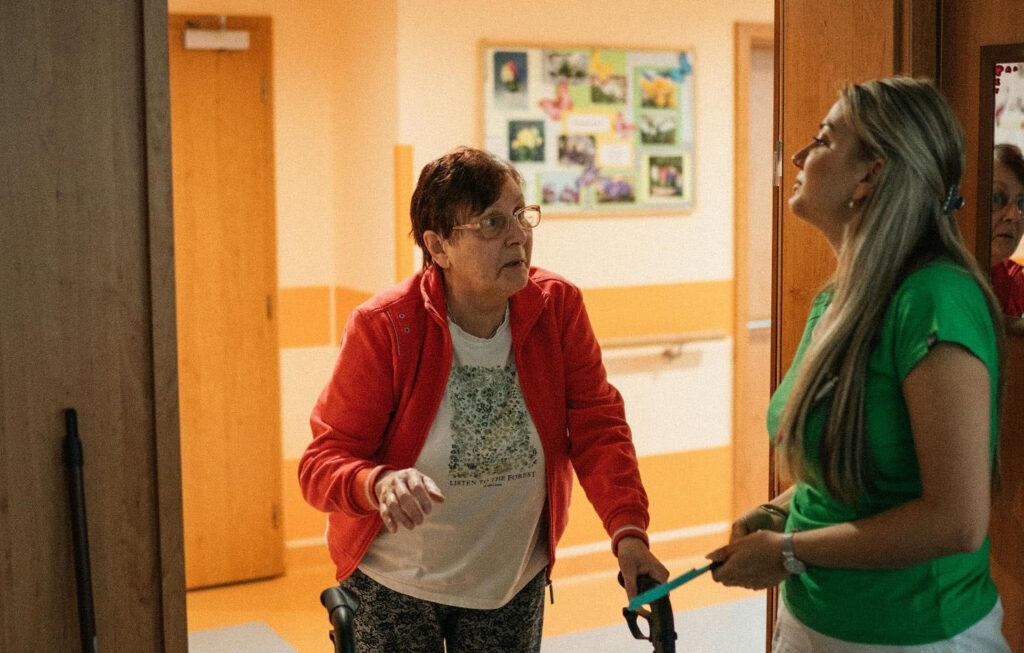 Elderly Woman with helper