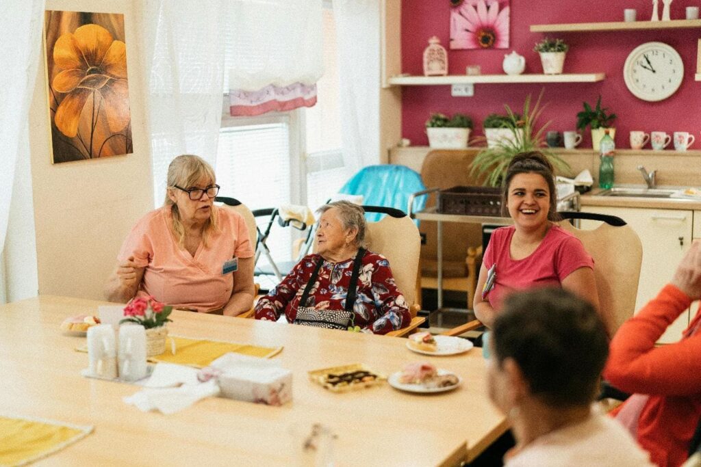 Staff, Patients, and Family around a table